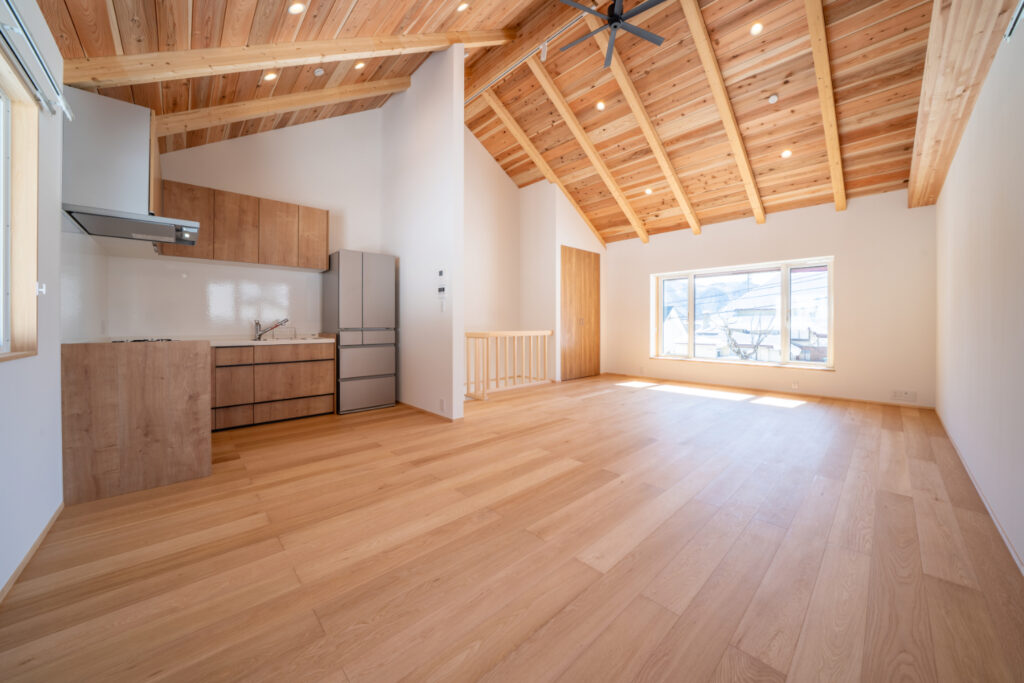 An image of the newly developed Iwatake Terrace Rentals. Showing the Lounge and dining area with high wooden ceilings and lots of natural light. 